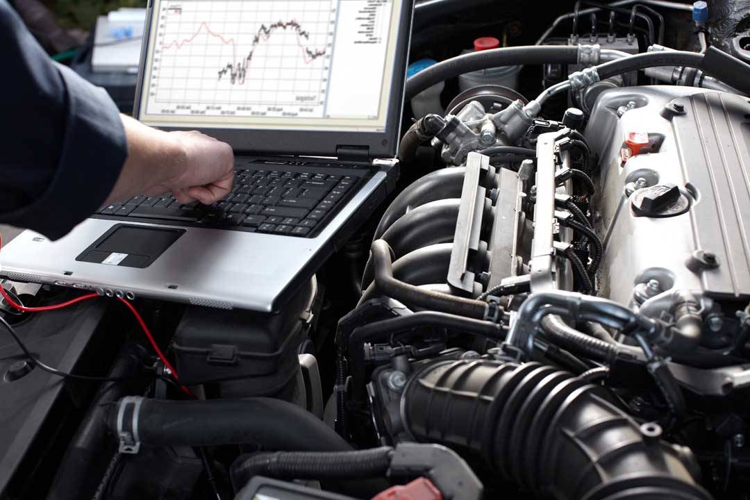 Car Mechanic Working In Auto Repair Service.